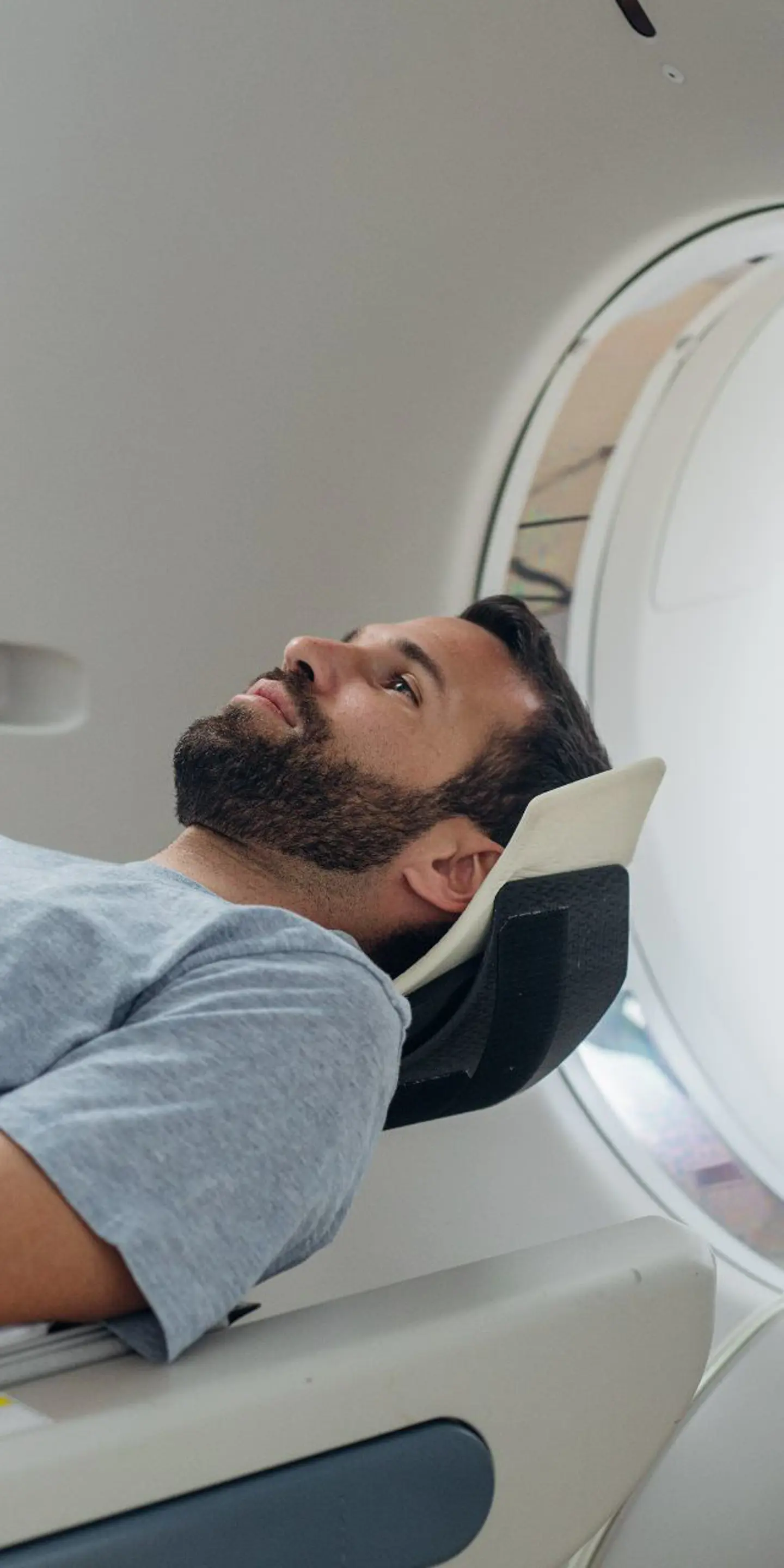 Patient Lying On The CT Scanner